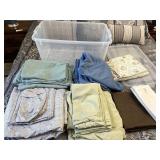 Coat full of queen size sheets and pillow covers