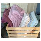 Wood crate full of towels