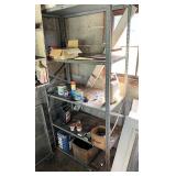 Five tiered metal shelf with contents