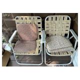 2 webbed chairs with cushions
