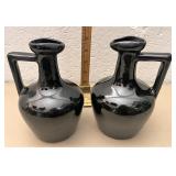Pair of black pictures one handle has repair