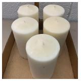 Five ivory pillar candles