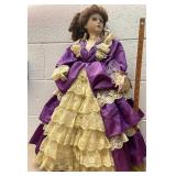 Lovely porcelain doll purple dress