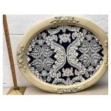 Oval framed coverlet
