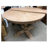 Round pedestal table with leaf