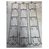 Three wrought iron plate racks