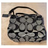 Authentic black and gray coach bag has a stain
