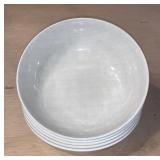 Five white plastic bowls