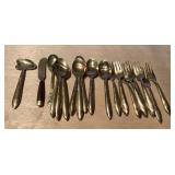 Gold finished forks and spoons and butter knives
