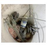 Bucket full of fence tighteners and kiwi crimp