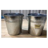 Two small metal buckets