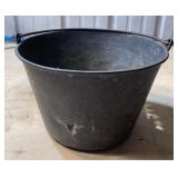Metal bucket with holes in it
