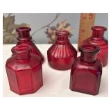 Red glass bottles