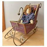 Doll in a sleigh decor
