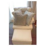 White chair with foot rest & throw pillows