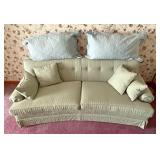 Green couch with pillows