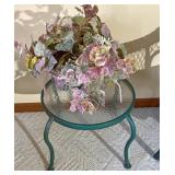 Outdoor table with artificial plant