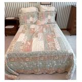 Regular size bed with linens and frame