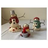 Snowman figurines in music box