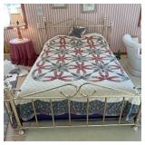 Queen bed with linens and frame