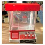 Miniature plastic claw machine