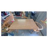 Dining room table with three chairs