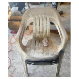 Two plastic outdoor chairs