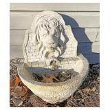 Concrete lion birdbath