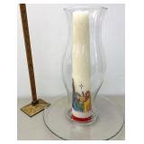 Hurricane with large nativity candle