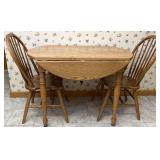 Drop leaf Oak kitchen table with two chairs