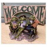 Welcome sign and frogs