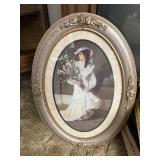 Oval framed lady artwork