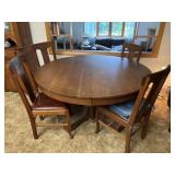 54 inch round oak table with four chairs