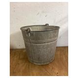 Galvanized bucket with holes in the bottom