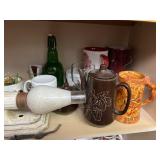 Contents of shelf to include bottles mugs and
