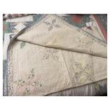Handstitched pinwheel quilt faded and have some
