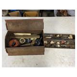 Metal toolbox full of pipe fittings