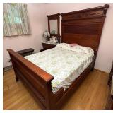 3/4 size bed with tall carved headboard
