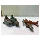 Vintage airplane and lead motorcycle man with