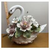 Porcelain Swan with flowers some petals are