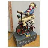 Snowman on bicycle