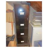 Black filing cabinet in basement