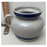 Stoneware bean pot has crack