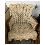 Upholstered chair with rivets