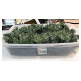 Tote with lid full of lighted garland