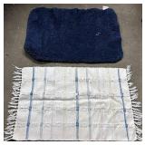Blue bath mat and multicolor rug