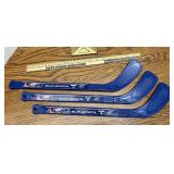 Three plastic blue jackets hockey sticks