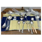 Assorted silver plate flatware and serving pieces