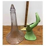 Green hand and glass piece