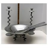 Serving bowl with candle sticks and utensils